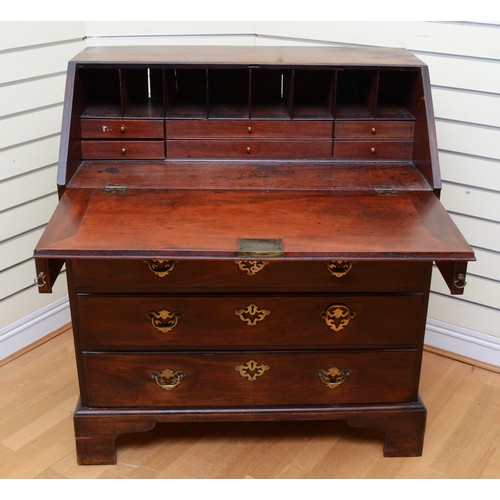 358 - A Georgian mahogany bureau, moulded rectangular fall front with rounded upper corners opening to fit... 