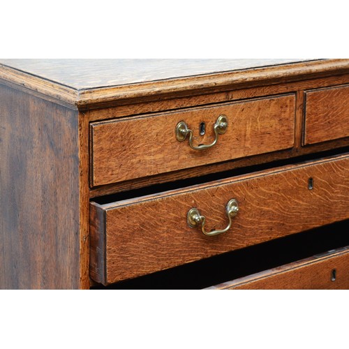 360 - A late 18th century Georgian oak chest, the moulded edged top over two short and three long cockbead... 