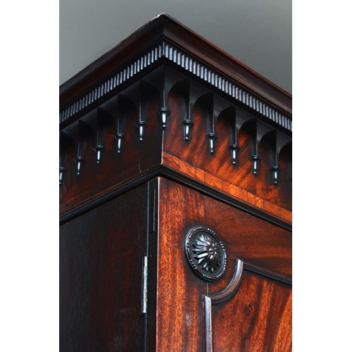 361 - A George III flame mahogany linen press, circa 1780s, the pierced cornice over a pair of beaded pane... 