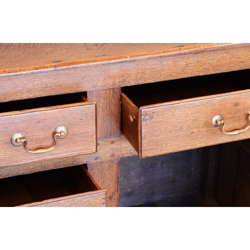 363 - A 19th century Georgian oak dresser, projecting cornice over shaped apron and three-tier plate rack,... 