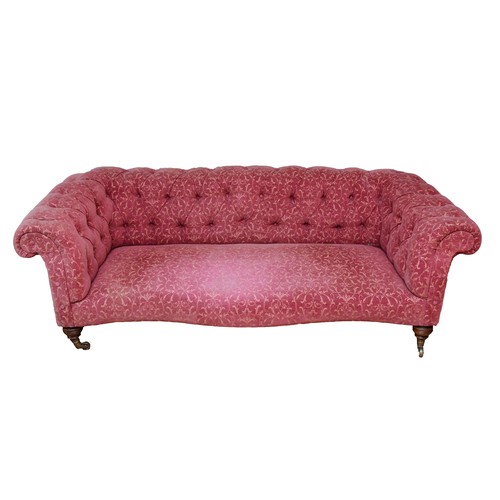 367 - An Edwardian Chesterfield sofa, upholstered in a burgundy Fleur De Lis pattern fabric, buttoned-down... 