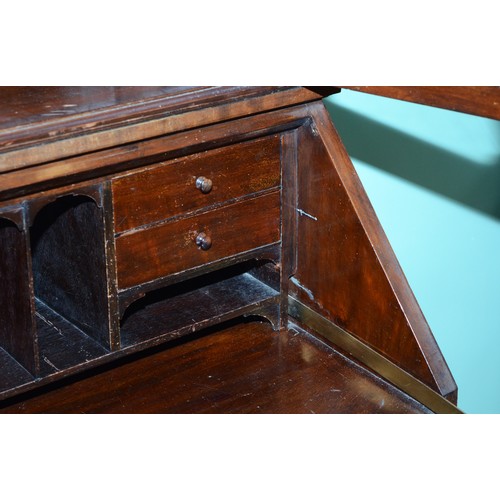 372 - A George III mahogany bureau bookcase, moulded dentil carved cornice over two astragal glazed doors,... 