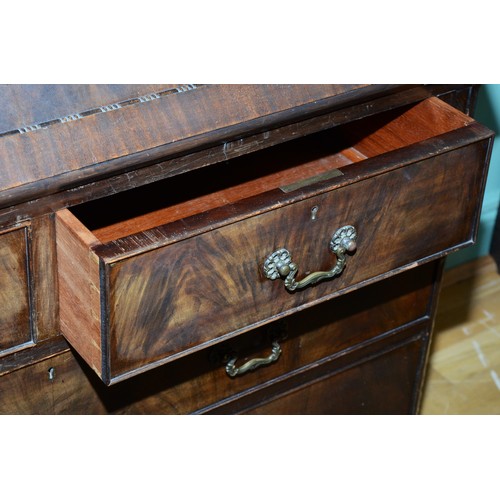 372 - A George III mahogany bureau bookcase, moulded dentil carved cornice over two astragal glazed doors,... 