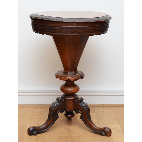 374 - A Victorian burr walnut sewing table of trumpet form, the thumb moulded lid opening to a baize lined... 