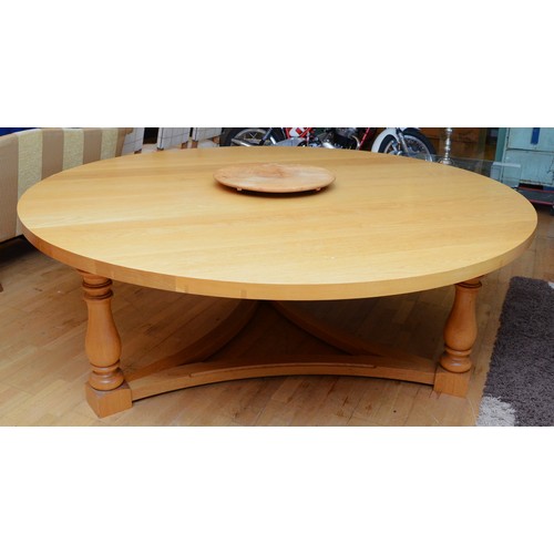 376 - A substantial and impressive modern dining table, light coloured solid oak construction, the rounded... 