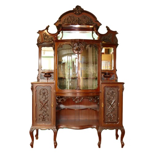 378 - A late Victorian carved mahogany mirror back display cabinet, the carved and pierced decorated arche... 