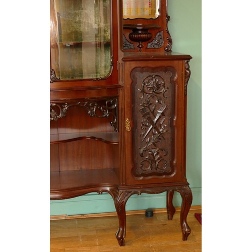 378 - A late Victorian carved mahogany mirror back display cabinet, the carved and pierced decorated arche... 