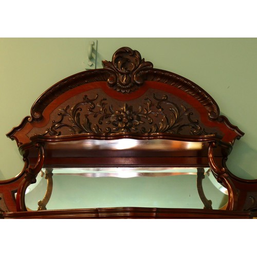 378 - A late Victorian carved mahogany mirror back display cabinet, the carved and pierced decorated arche... 