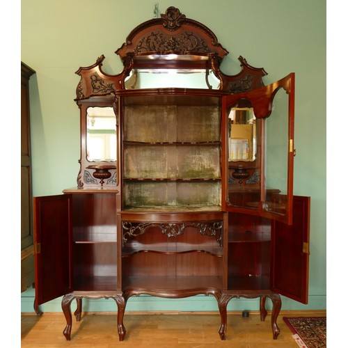 378 - A late Victorian carved mahogany mirror back display cabinet, the carved and pierced decorated arche... 