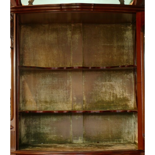 378 - A late Victorian carved mahogany mirror back display cabinet, the carved and pierced decorated arche... 