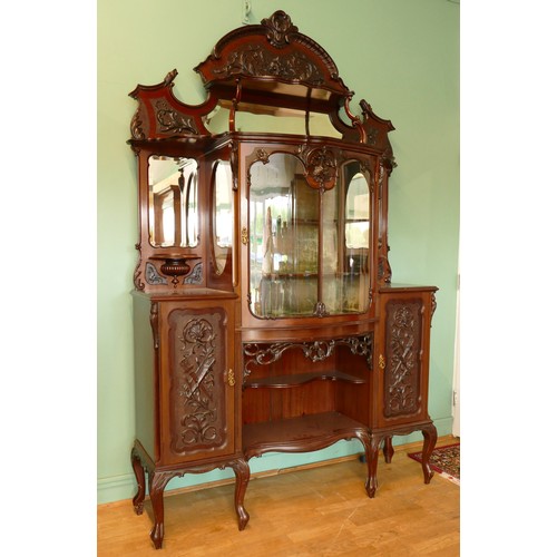 378 - A late Victorian carved mahogany mirror back display cabinet, the carved and pierced decorated arche... 