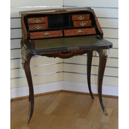 380 - A French mahogany and walnut bureau de dame, in the Louis XV style, ormolu mounted, the cartouche sh... 