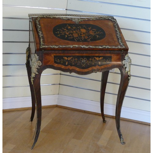 380 - A French mahogany and walnut bureau de dame, in the Louis XV style, ormolu mounted, the cartouche sh... 