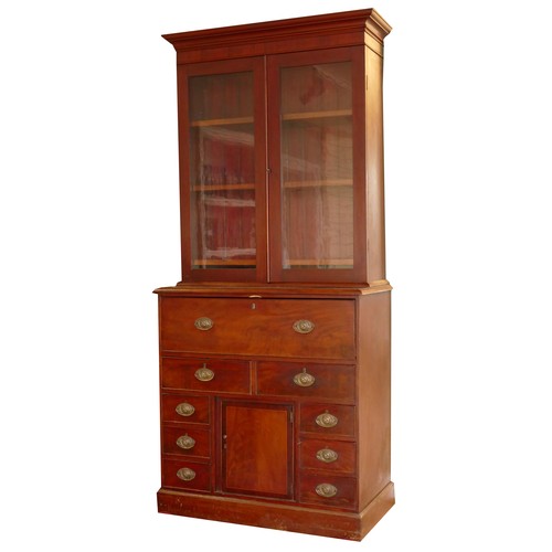 381 - A late 19th century mahogany secretaire bookcase, the top with a stepped pediment over two glazed do... 