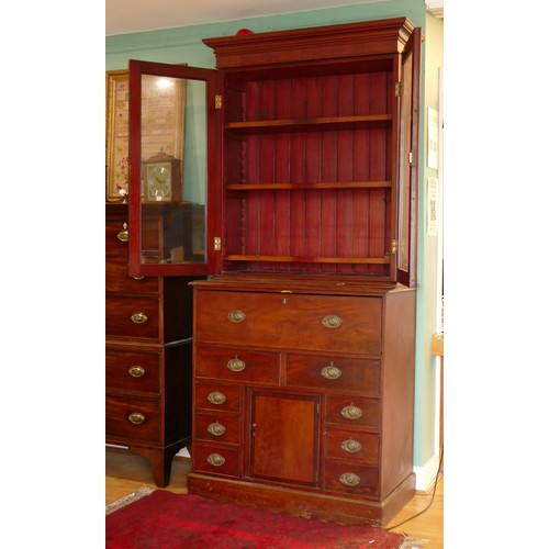 381 - A late 19th century mahogany secretaire bookcase, the top with a stepped pediment over two glazed do... 