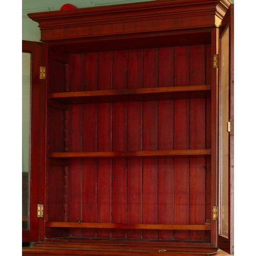 381 - A late 19th century mahogany secretaire bookcase, the top with a stepped pediment over two glazed do... 