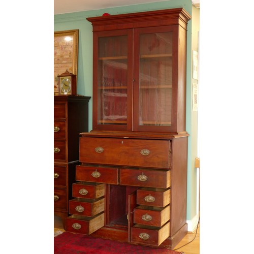 381 - A late 19th century mahogany secretaire bookcase, the top with a stepped pediment over two glazed do... 