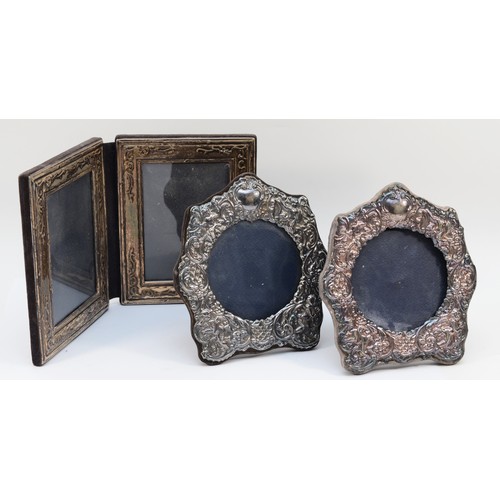 16 - A silver double photograph frame, Birmingham 1985, each 14 x 18cm and two other silver mounted photo... 