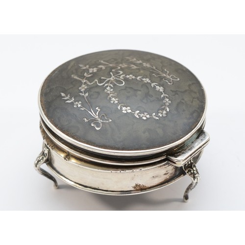 25 - A silver and tortoiseshell trinket box, Birmingham 1911, hinged cover, diameter 7cm