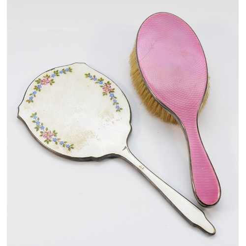 34 - A silver and white guilloche enamel hand mirror, Birmingham 1948 and a silver and pink guilloche ena... 