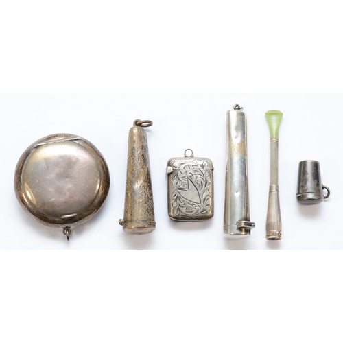 66 - A silver vesta case, Birmingham 1900, three silver cheroot holder cases, a cigarette holder and a po... 