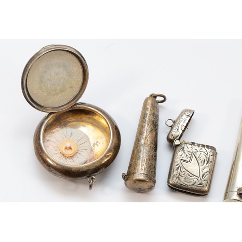 66 - A silver vesta case, Birmingham 1900, three silver cheroot holder cases, a cigarette holder and a po... 