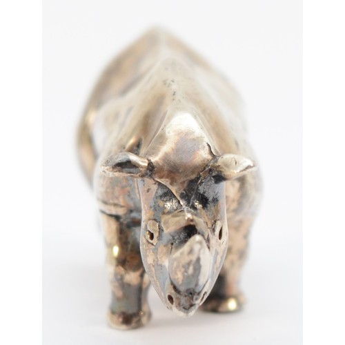 67 - A solid silver Rhinoceros statue, by Clive & Clarissa Cooke,  London 1988, 41mm, 35gm.