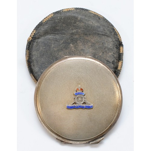 76 - WWII Royal Artillery; a silver circular compact, Birmingham 1940, with applied enamel crest, opening... 