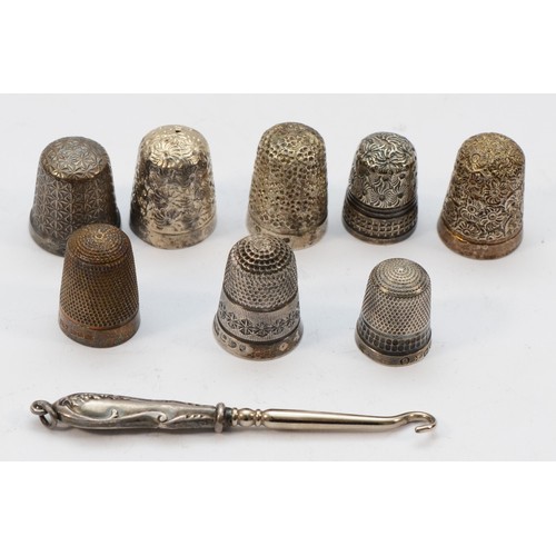 103 - Seven silver thimbles, including Charles Horner, an unmarked example and a silver button hook