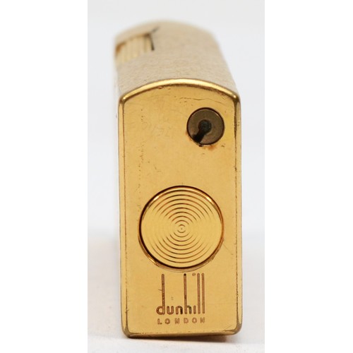 104 - Dunhill, a gold plated rollagas cigarette lighter