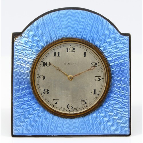 105 - An Art Deco silver and blue guilloche enamel bedside eight day clock, Birmingham 1928, 8 x 7cm, work... 