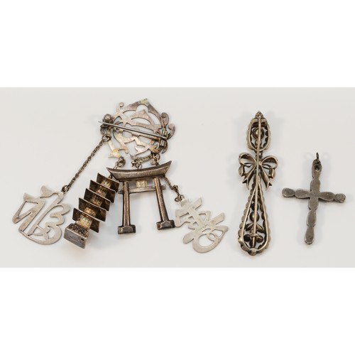 143 - A 19th century silver and paste bow brooch, 72mm, a Victorian silver and paste cross and a monogram ... 