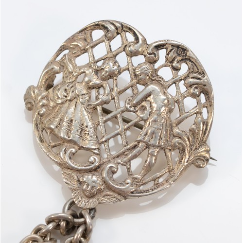 155 - A cast silver brooch, maker and Registered design number only, with a silver mesh purse, lion passan... 