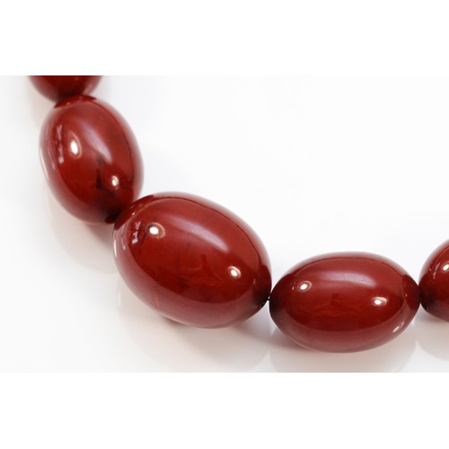 177 - A cherry Bakelite amber bead necklace, largest bead, 28mm, 43gm