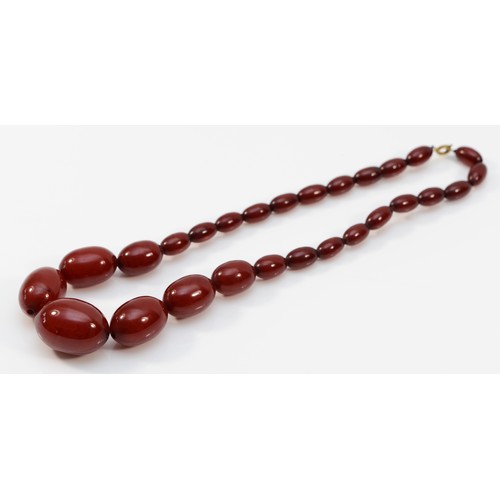 177 - A cherry Bakelite amber bead necklace, largest bead, 28mm, 43gm