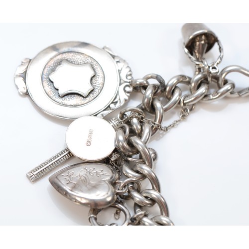 179 - A silver charm bracelet, 91gm