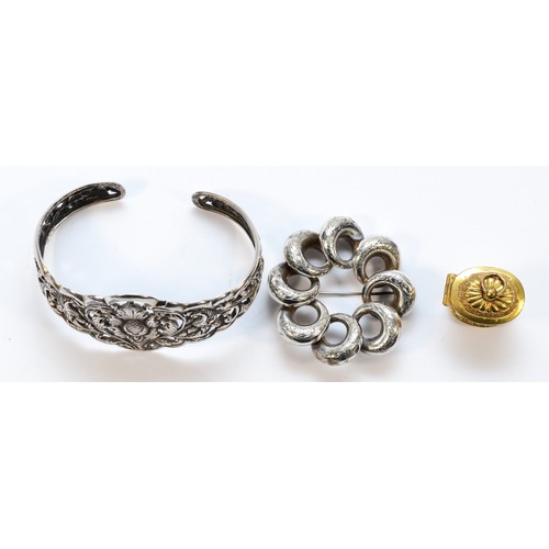 188 - An 800 standard silver floral chased and pierced bangle, a Victorian silver hoop brooch, 48mm and a ... 