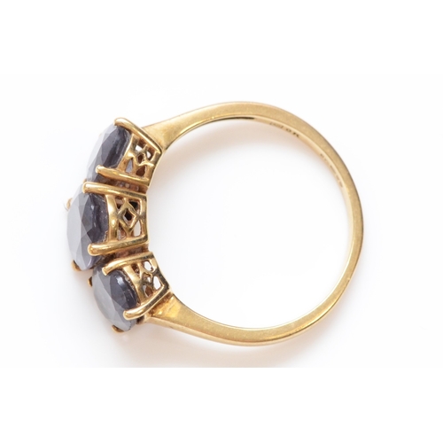 220 - A 9ct gold and iolite three stone ring, P, 2.8gm