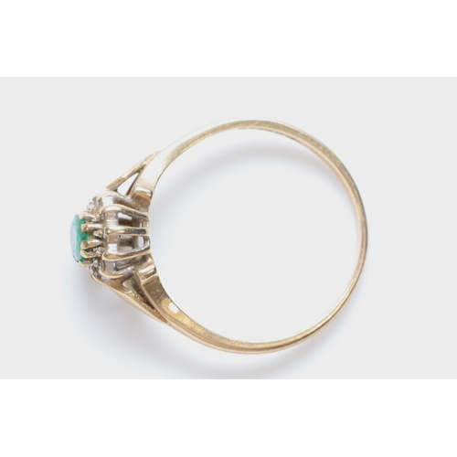 258 - A 9ct gold emerald and diamond cluster ring, R, 2.5gm