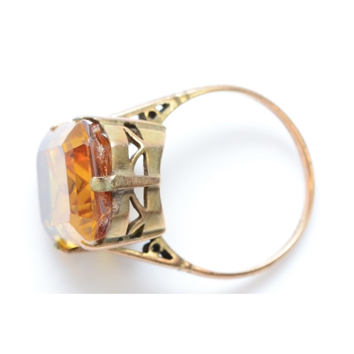 260 - A 9ct gold and yellow gemstone ring, 16 x 12mm, O, 5.9gm