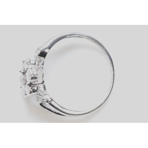 265 - A 9ct white gold and diamond cluster ring, L 1/2, 2gm