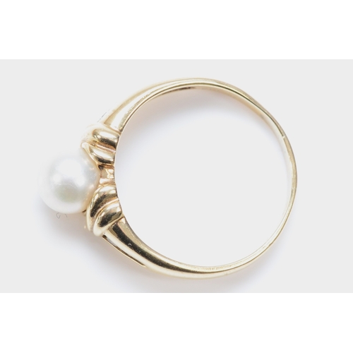 294 - A 9ct gold and 7mm cultured pearl dress ring, brilliant cut diamond channel set shoulders, S, 3.6gm