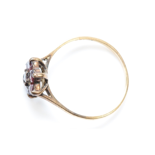 298 - A 9ct gold garnet cluster ring, V, 2.7gm