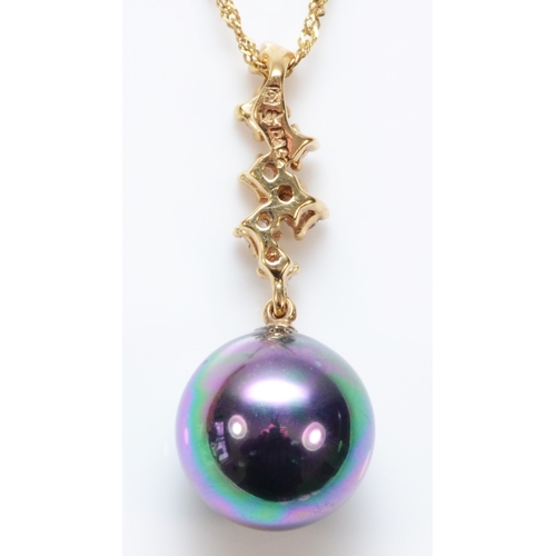 301 - A 9ct gold, 9mm imitation pearl and white stone pendant, chain, 2.6gm