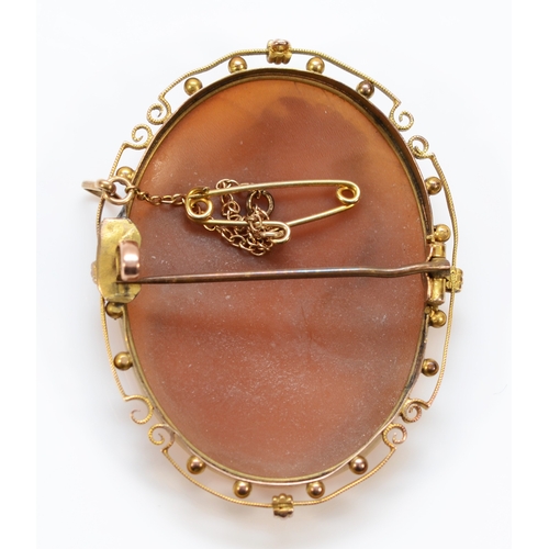 369 - A 9ct gold shell cameo brooch with base metal pin, brooch measures 45mm in length, 8.9g