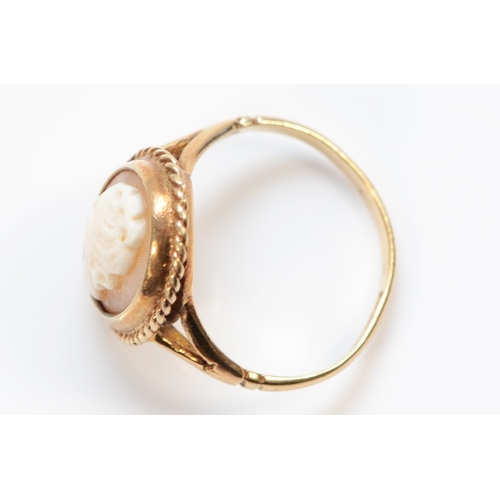 374 - A 9ct gold shell cameo dress ring, K 1/2, 2.6g