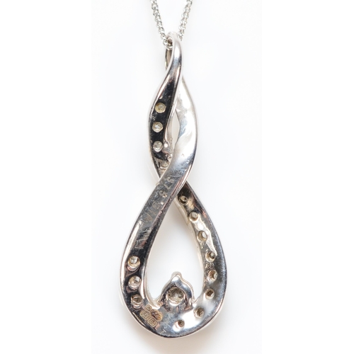 394 - A 9ct white gold diamond pendant with a 9ct white gold chain, pendant measures 20mm, 1.4g