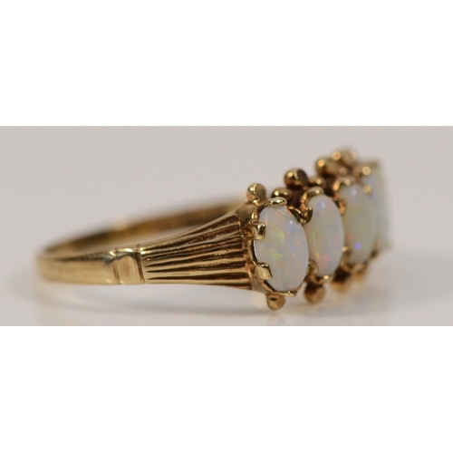 402 - A 9ct gold opal five stone ring, P, 2.1g