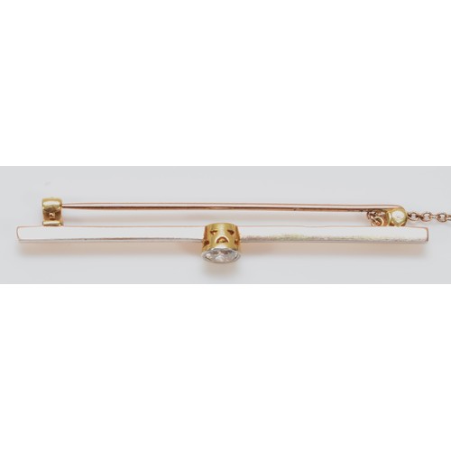 426 - An Edwardian 15ct gold and platinum bar brooch, collet set with an old cut brilliant diamond, approx... 