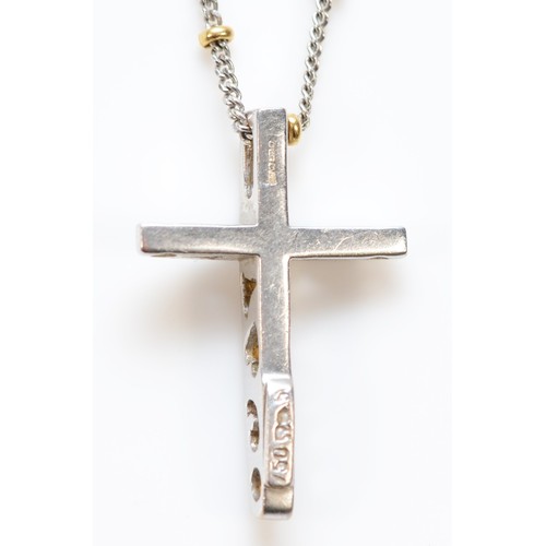 436 - An 18ct white gold and brilliant cut diamond cross pendant, to a white gold and yellow gold bead cha... 